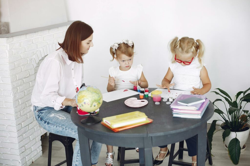 a mother conducting preschool lessons at home in a designated workspace