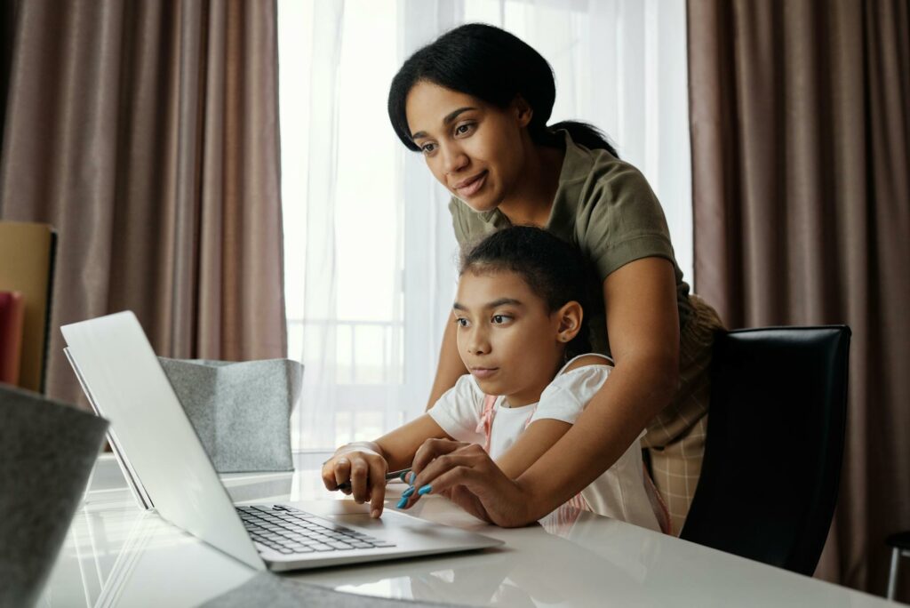 A parent helping their child develop healthy study habits